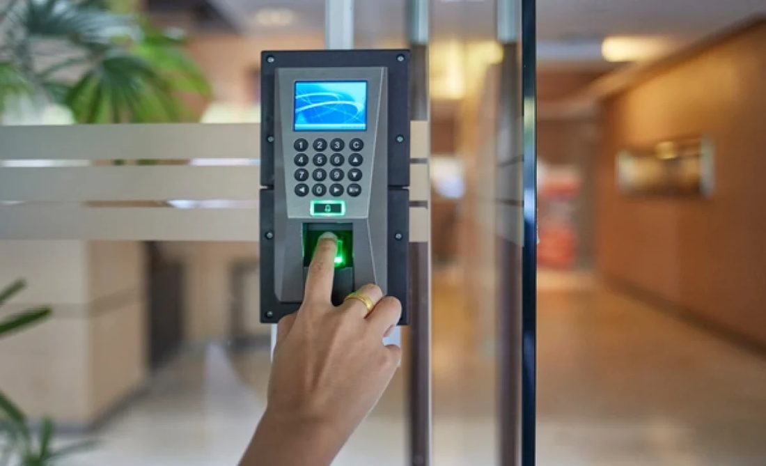 Biometric fingerprint access control reader at an office entrance